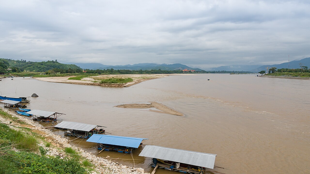 The Golden Triangle (Sop Ruak), Chiang Rai — the Mekong where Thailand, Laos and Myanmar meet, with long-tail boats along the bank, out of town to the north and reached by a separate ride