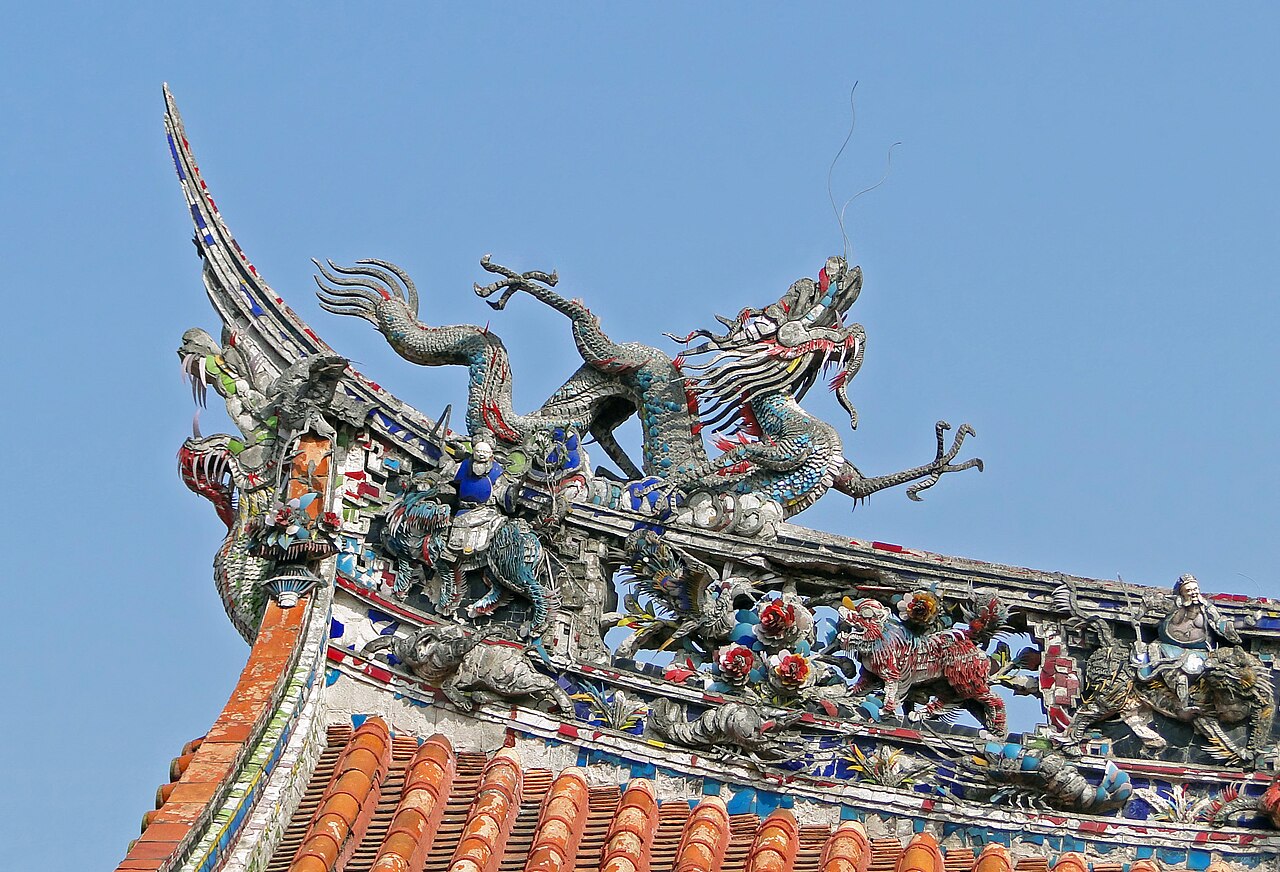 Glazed ceramic dragon ornament on the roofline of Longshan Temple Taipei, jianinian mosaic craft in vivid colours