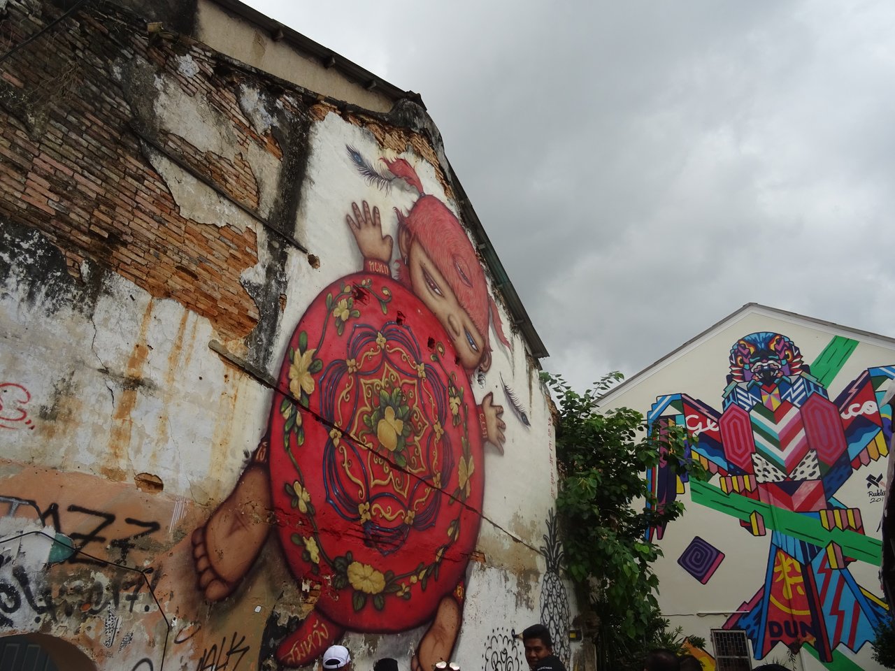 Street art on Thalang Road, Old Phuket Town — a wall mural depicting Phuket and Baba life