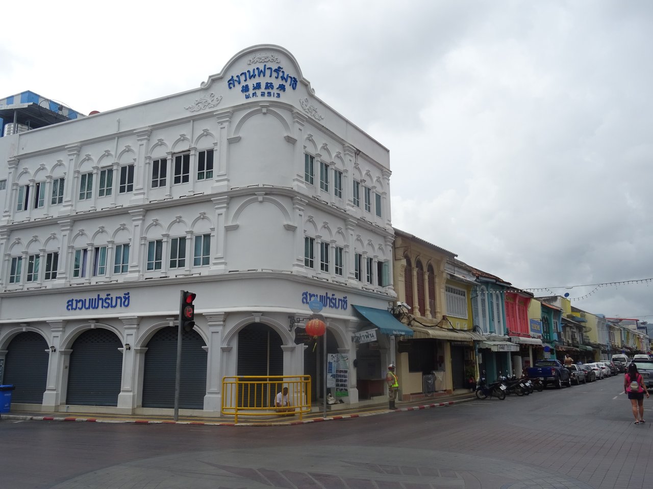 Thalang Road, Old Phuket Town — a terrace of pastel Sino-Portuguese shophouses with the covered five-foot way