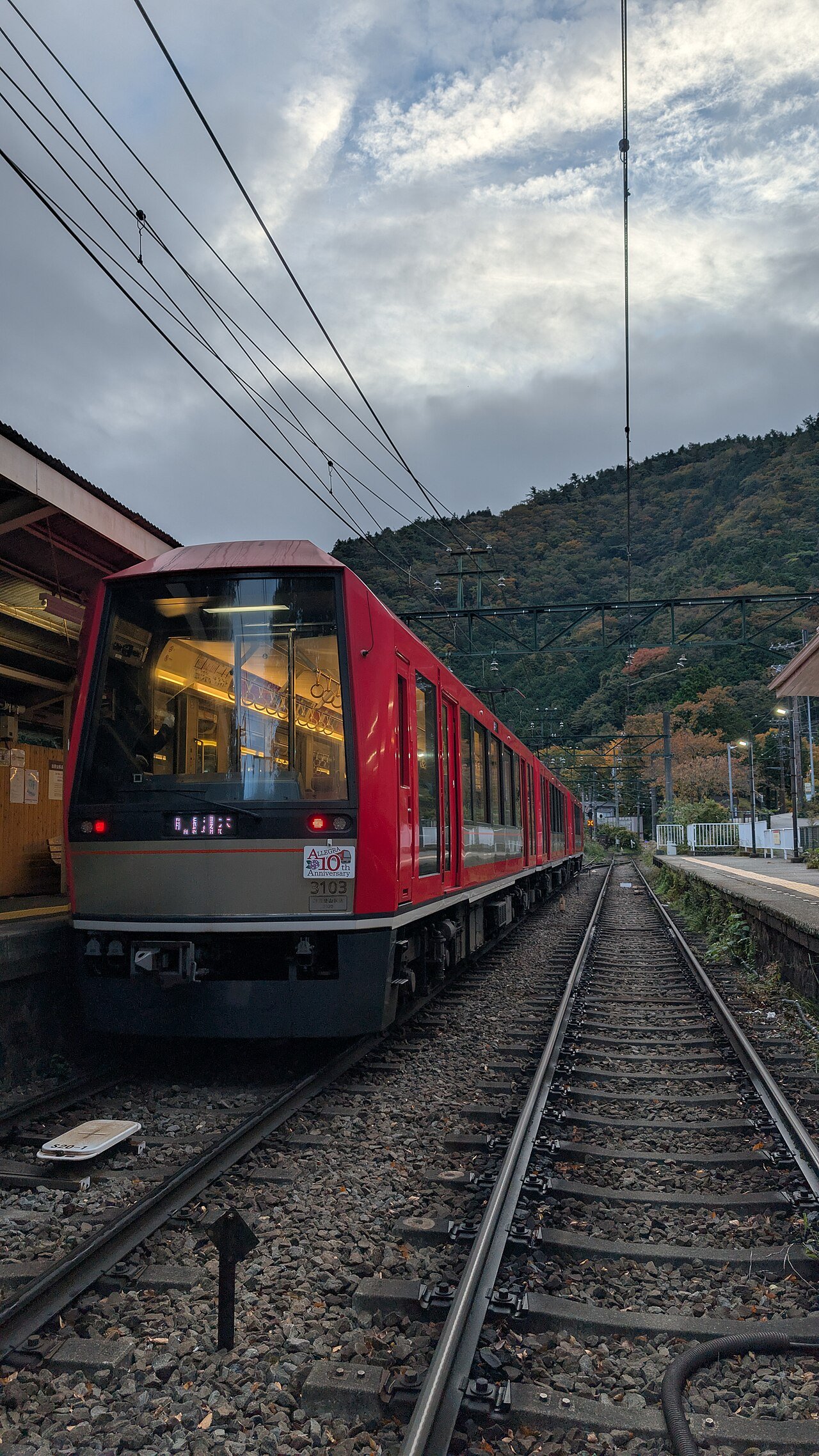 The Hakone Tozan Railway winding through lush green forest on a steep slope in Hakone during the rainy season