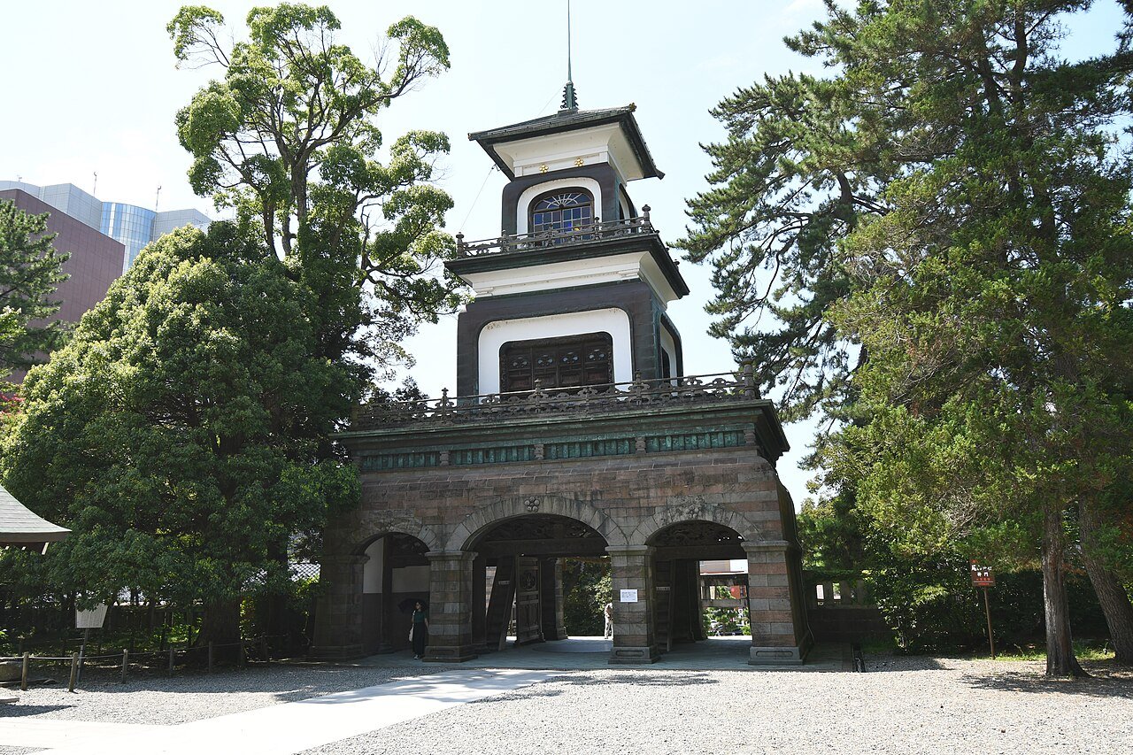 Oyama Shrine Kanazawa — three-storey Shinmon gate combining Japanese, Chinese and European Gothic stained-glass architecture, lit at night