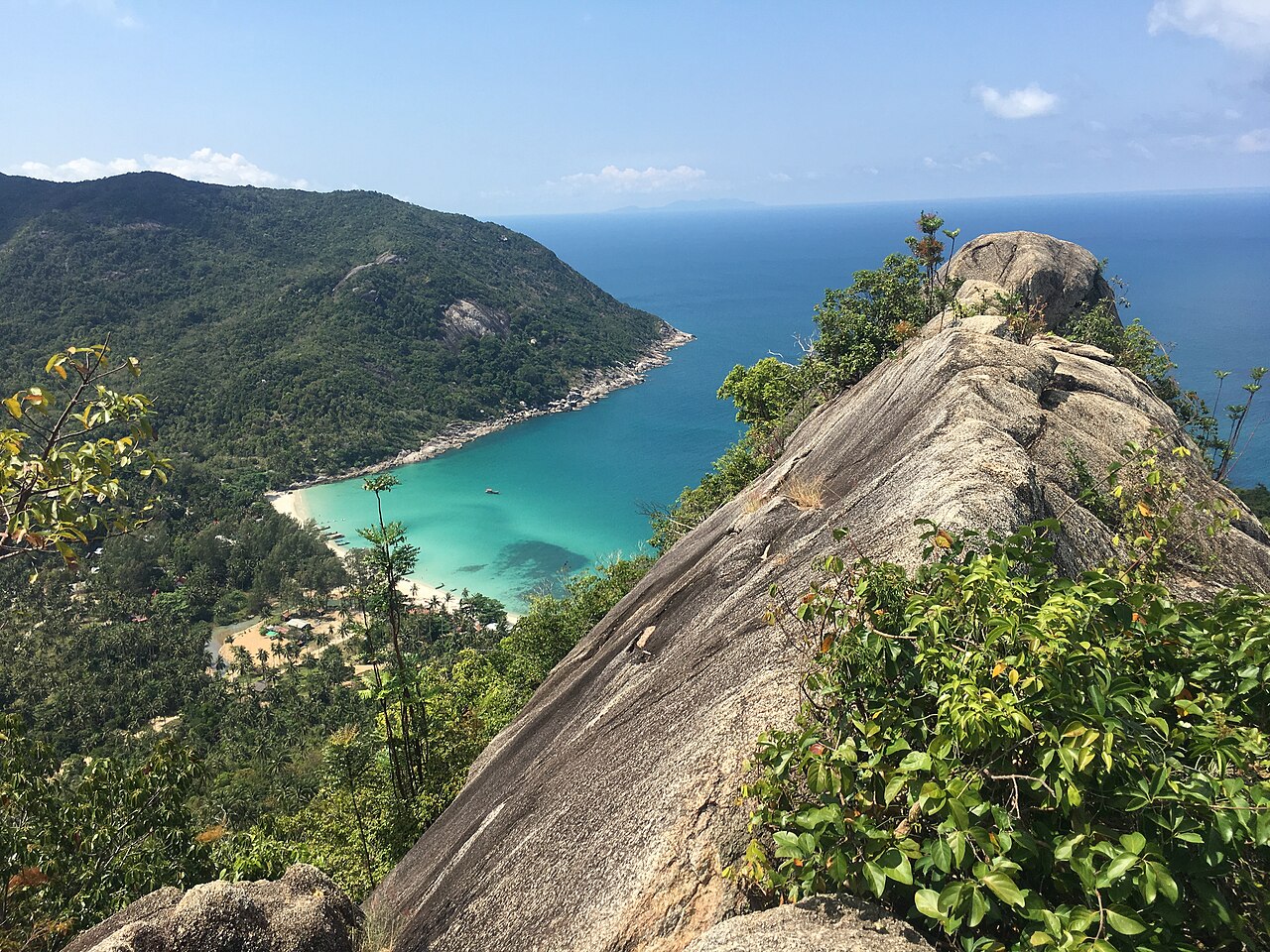 Bottle Beach and the Domsila viewpoint on Koh Phangan, a turquoise bay framed by jungle and a granite boulder