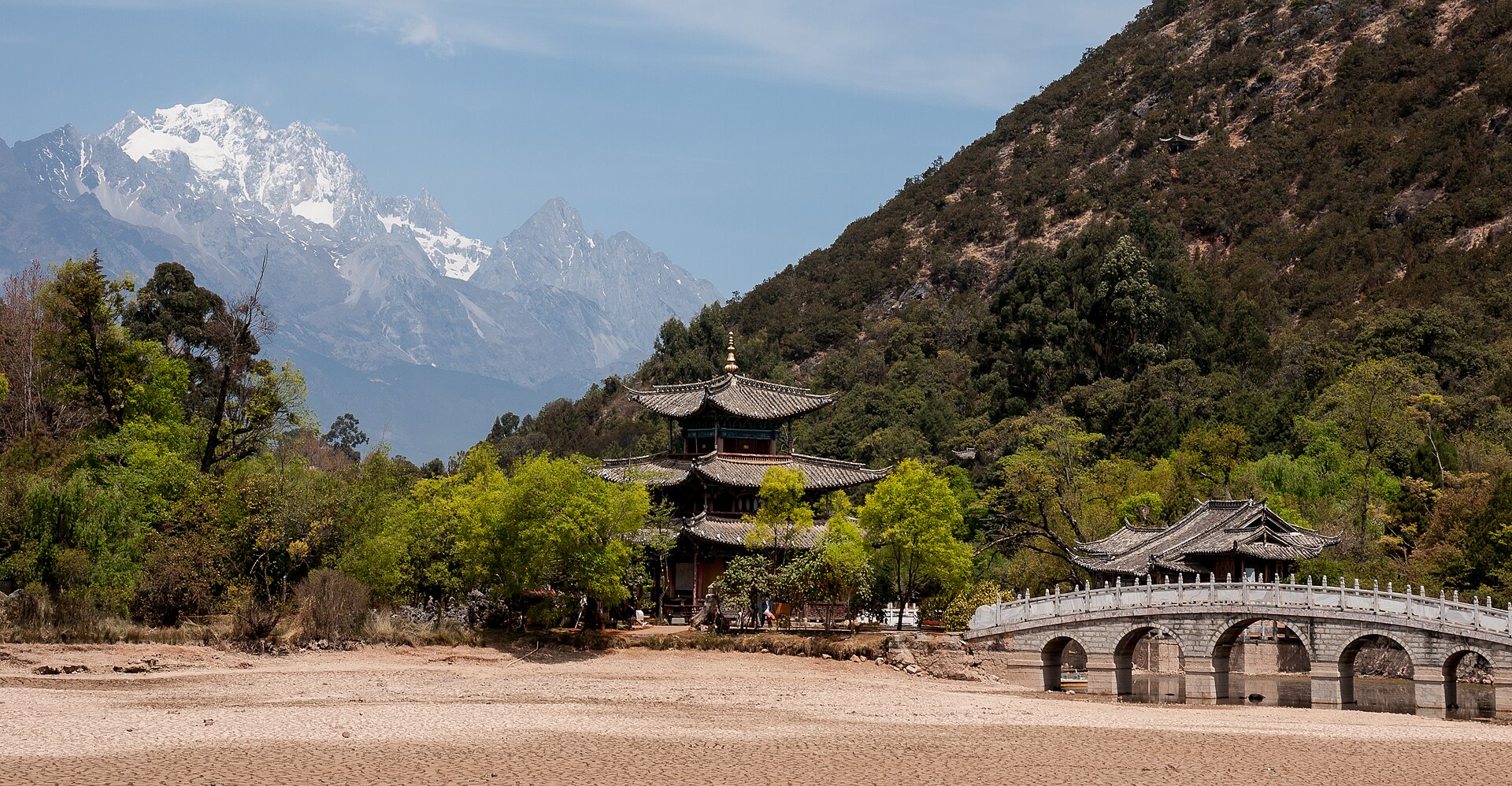 Black Dragon Pool with the Deyue Pavilion and Jade Dragon Snow Mountain behind it in Lijiang — China