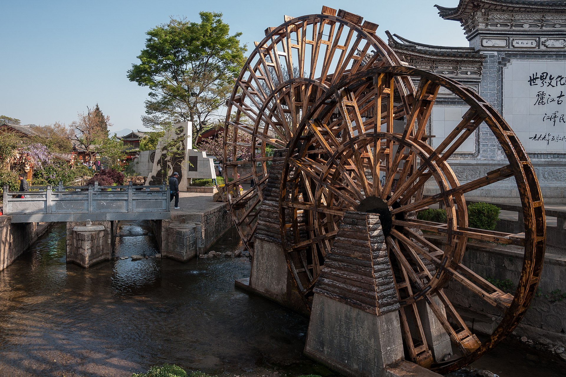 The big water wheels at the north gate of Lijiang Old Town beside the canal — China