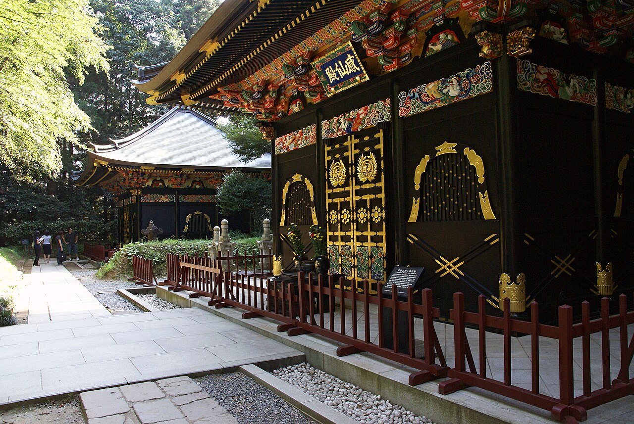 Zuihoden mausoleum in Sendai, ornate Momoyama-style architecture with gold and black lacquer surrounded by cedar trees