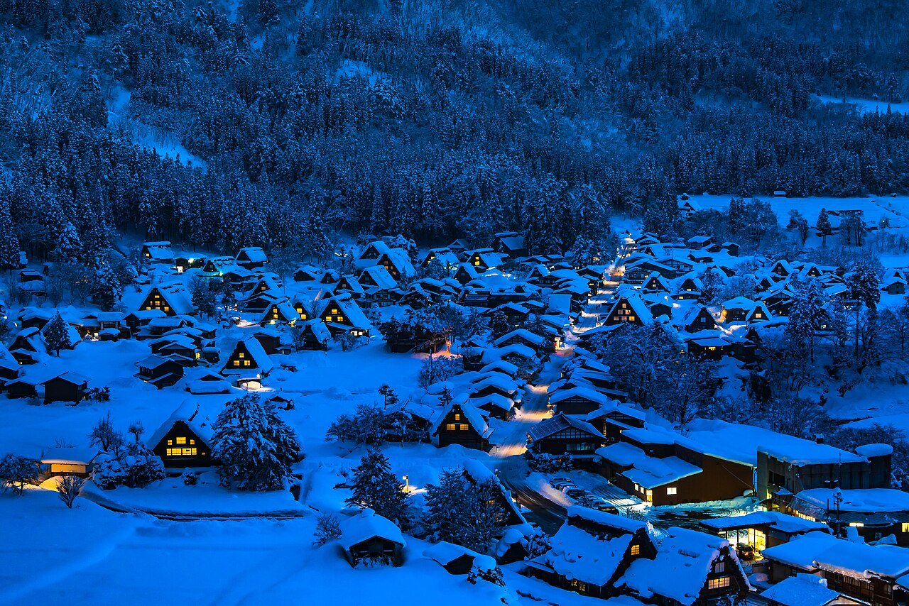 Shirakawa-go village blanketed in snow at night in winter in Japan