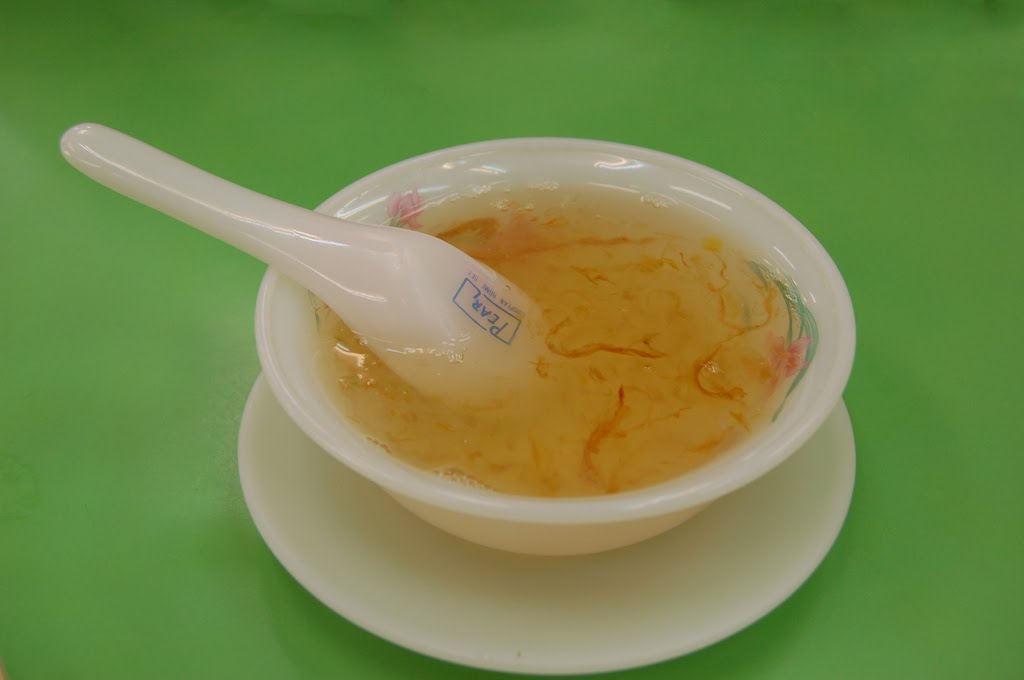 Stewed bird's nest in a white ceramic bowl with a spoon, a Chinese tonic drink at an old shop in Hat Yai