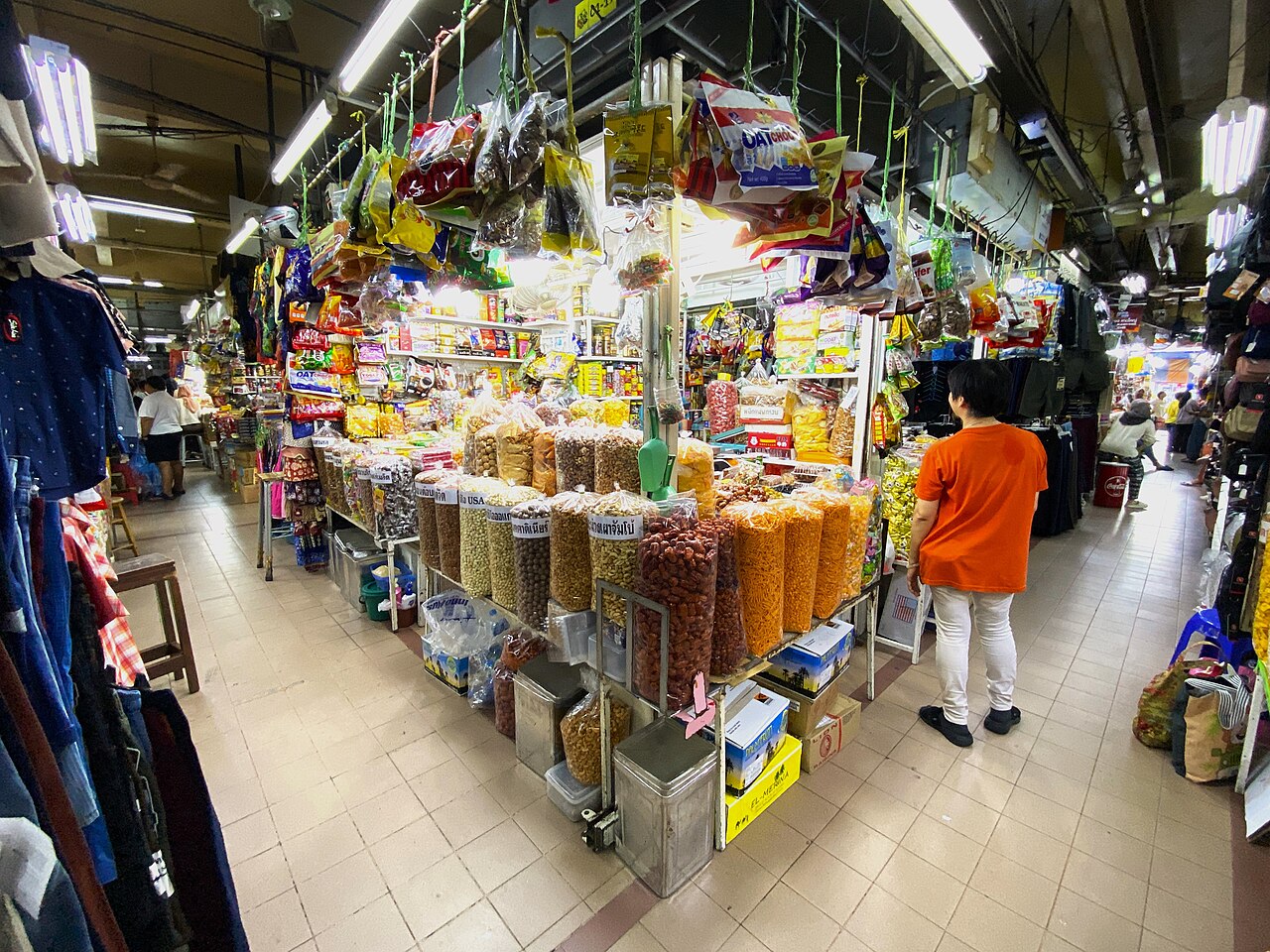 Food and dried-goods stalls inside Kim Yong Market in Hat Yai, with nuts, snacks and treats lined up in clear containers