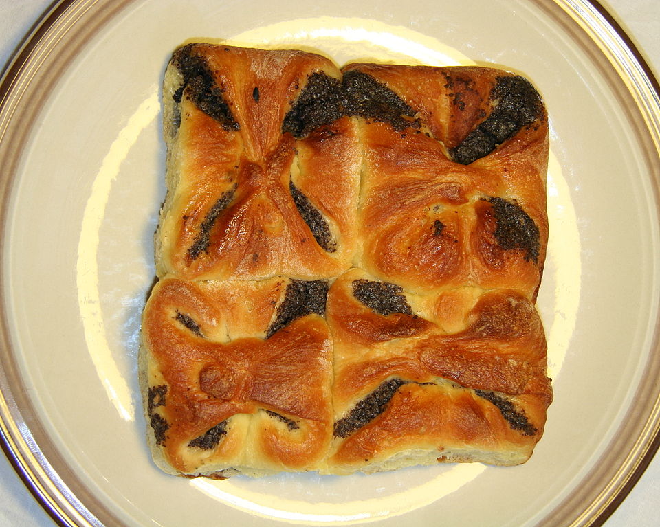 Several Czech kolaches with fruit and sausage fillings