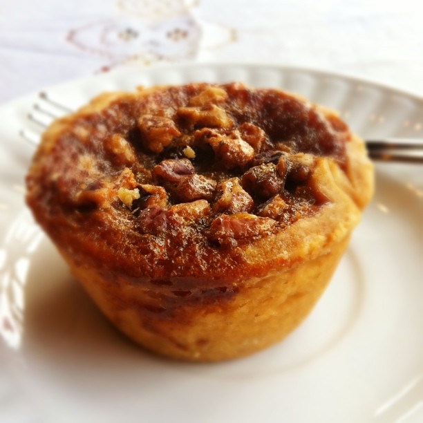 Butter tart with brown sugar filling in a crisp pastry shell