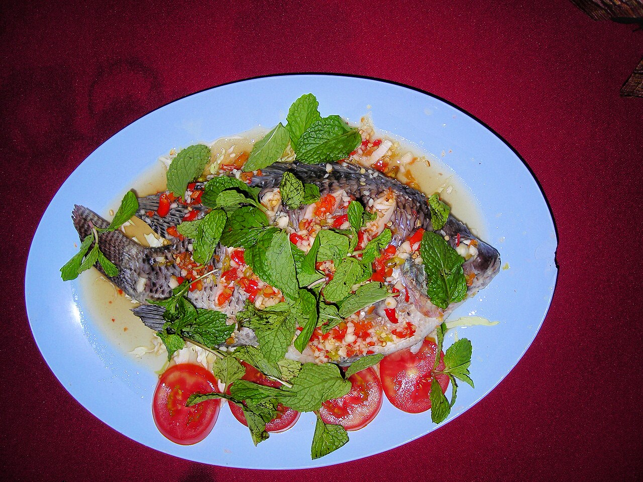 Whole fish steamed with lime and a garlic-chilli sauce — a popular fresh-fish dish in Phuket