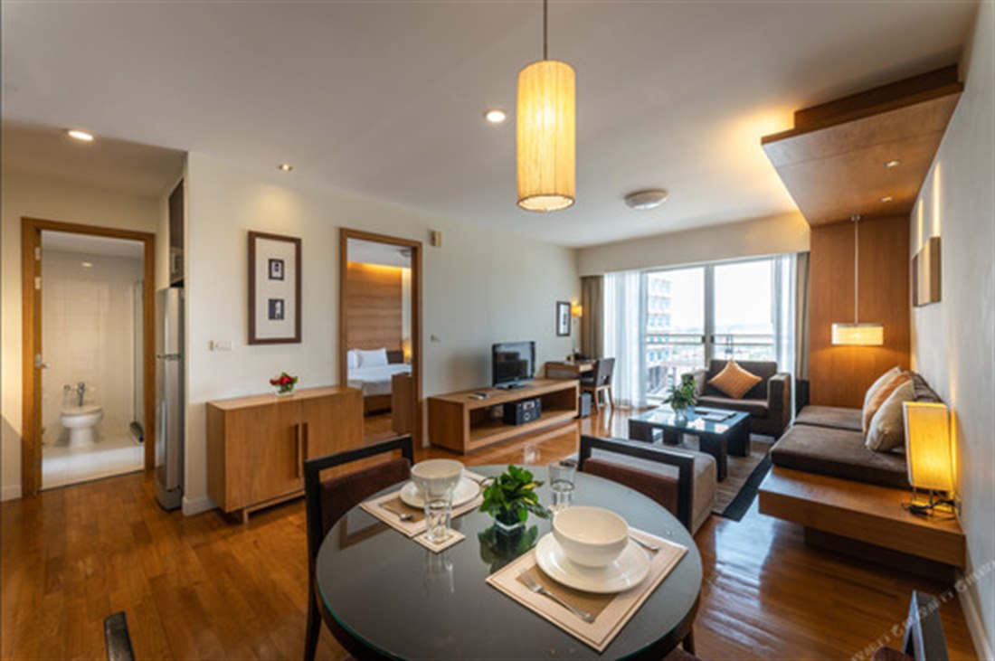 Living and dining area of a One Bedroom Suite with kitchen at Kantary Hotel Ayutthaya