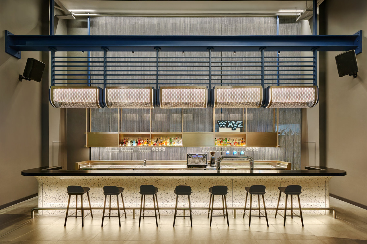 W XYZ Bar counter with a neon sign