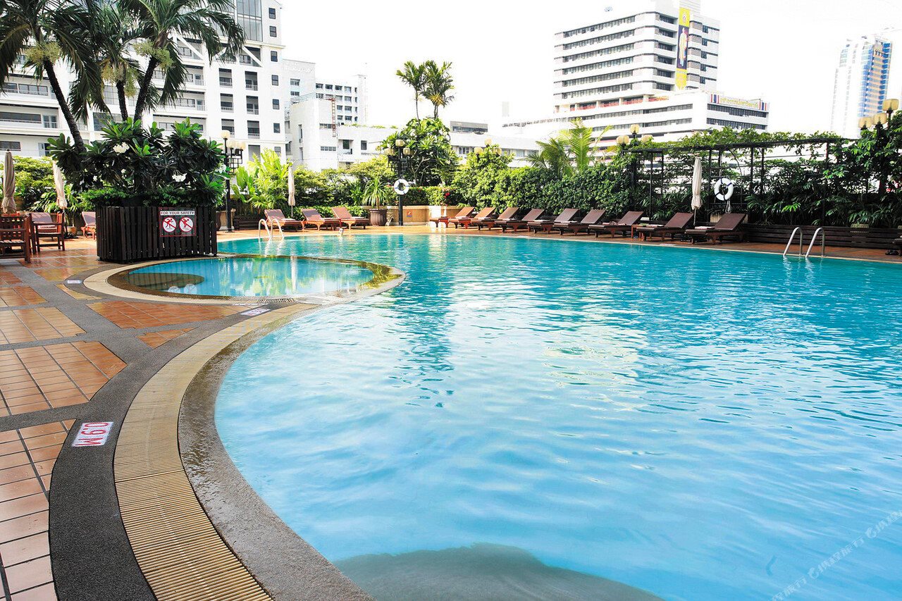 Outdoor pool at Novotel Bangkok on Siam Square with the hotel tower behind