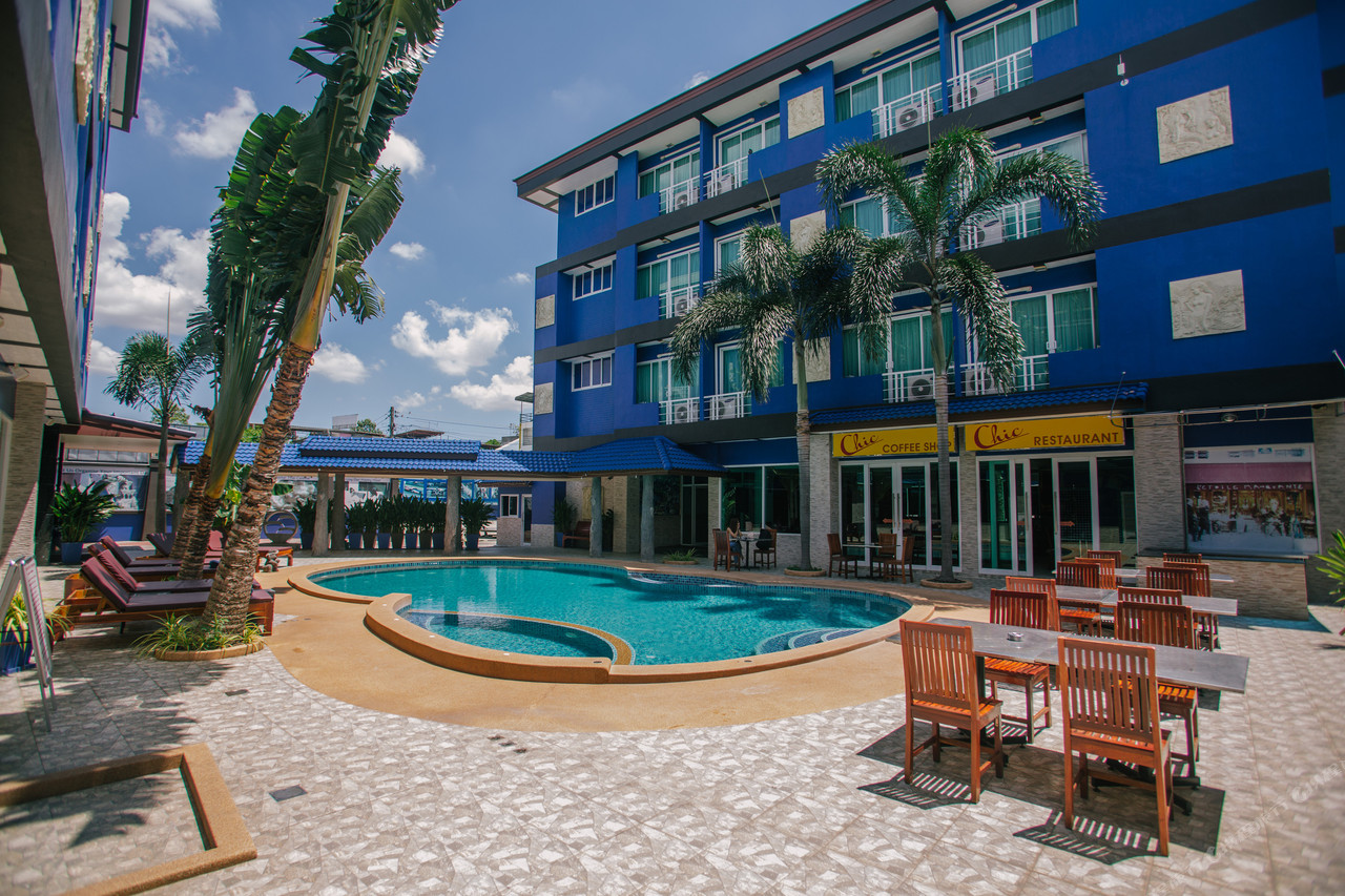 Outdoor saltwater pool and the blue building of Best Western Royal Buriram