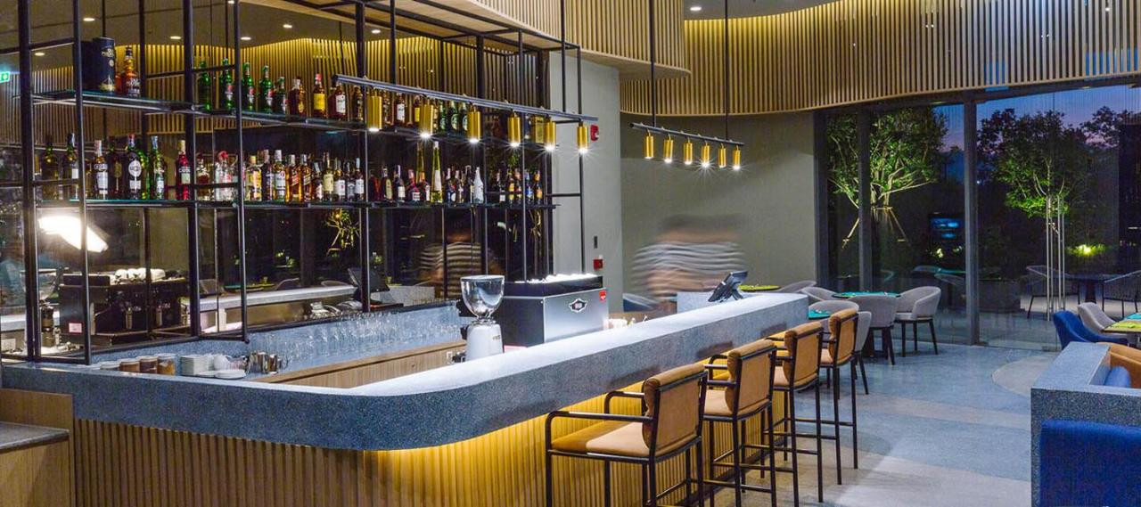 The bar at Bistro@M in the evening with terrace seating