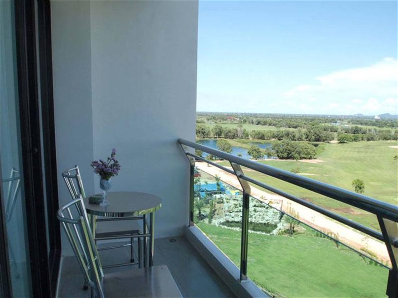 Room balcony looking out over the fairway and the golf course lagoon