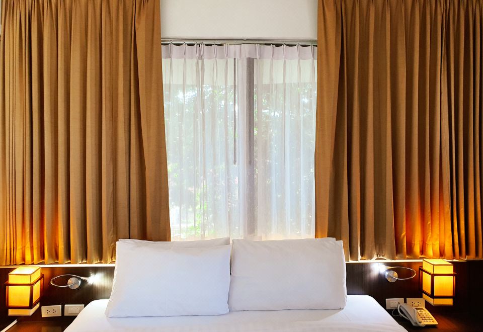 ห้องพักโรงแรม Hotel M Chiang Mai พร้อมเตียงคู่แสงอบอุ่น
