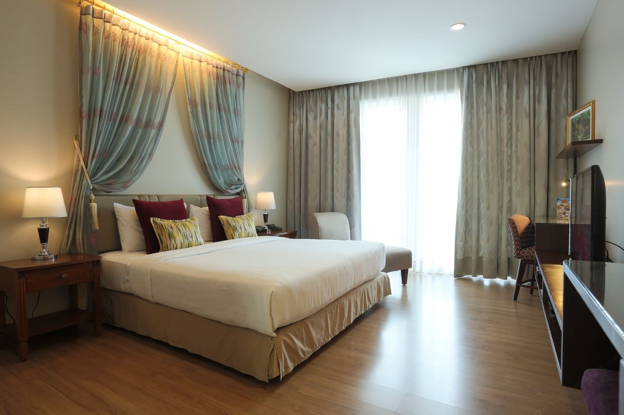 Le Patta Chiang Rai room with wood floors, private balcony and pool view