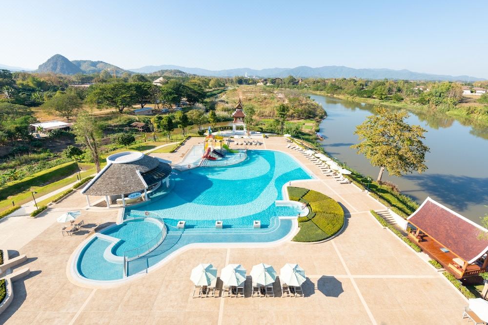 Aerial view of the pool and water park at The Riverie by Katathani beside the Kok River