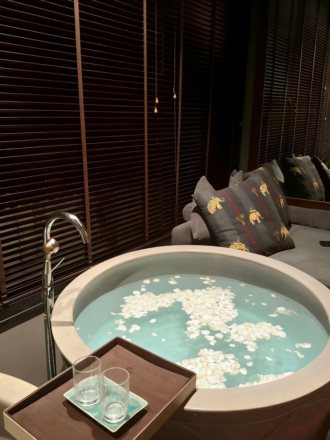 Spa room at Avani Pattaya with a petal-strewn soaking bath