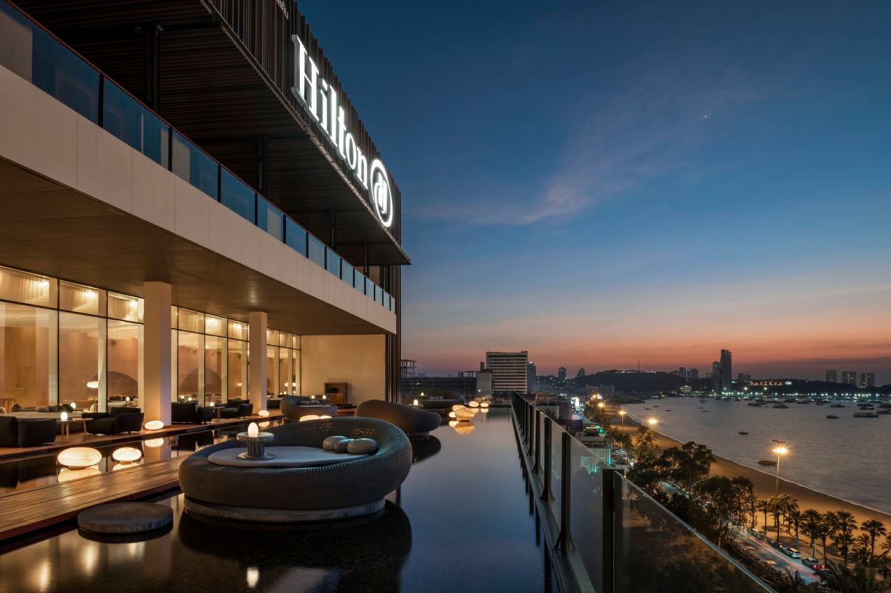 Drift Bar at dusk with Pattaya Bay and city lights