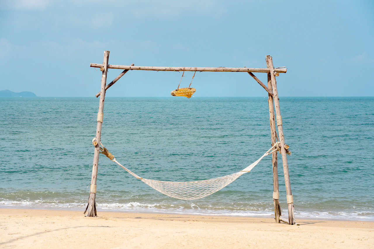 Beach swing and hammock on the private beach at Renaissance Pattaya facing the sea