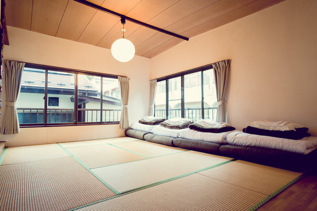 Tatami dormitory room with Japanese futons at Hakone Tent