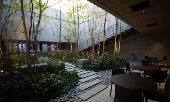 Hotel Metropolitan Kamakura's tranquil inner courtyard garden with stepping stones and lush greenery