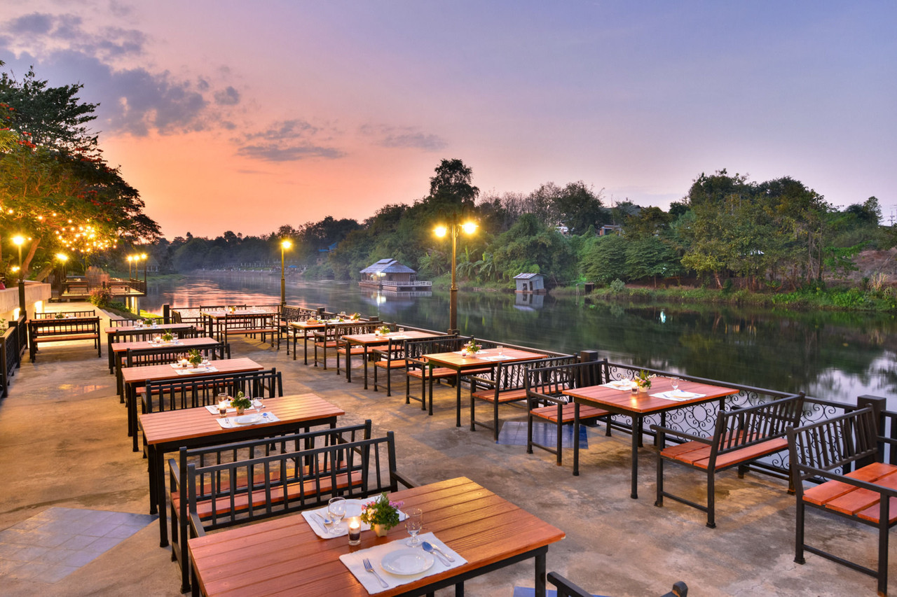 Riverside restaurant terrace on the River Kwai at sunset