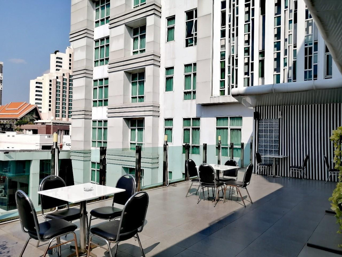 Rooftop terrace with Khon Kaen city views and seating