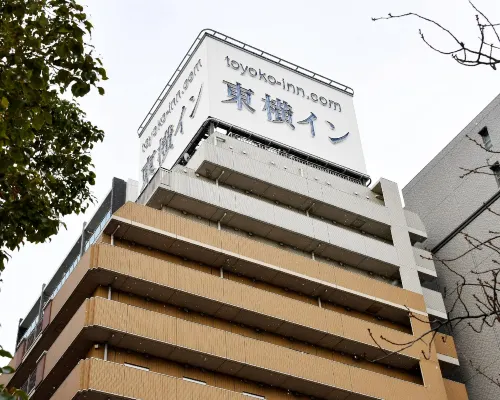 Toyoko Inn Kobe Sannomiya exterior with hotel signage