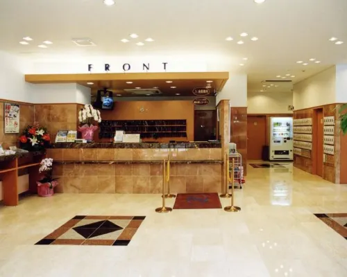 Toyoko Inn Kobe Sannomiya exterior with hotel signage
