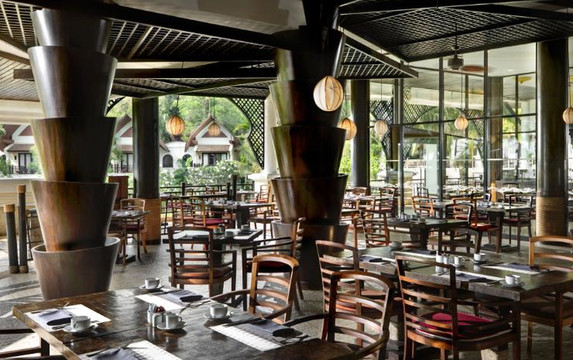 Watermark restaurant, an open-sided pavilion with sculptural timber columns set in tropical gardens