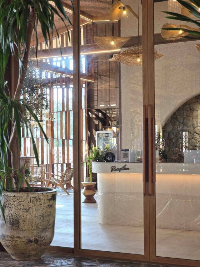Cocohut Village lobby and reception desk finished in wood and stone