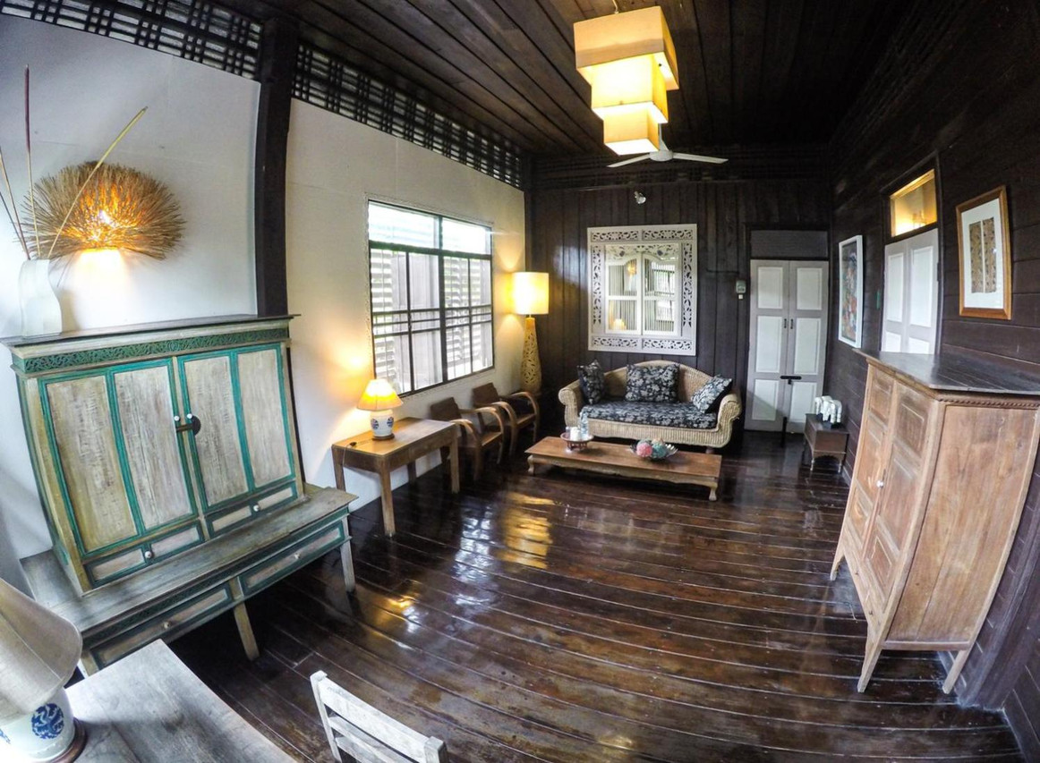 Communal teak lounge with carved Lanna antique furniture