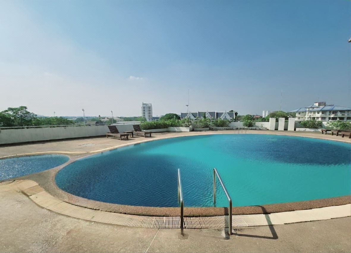 Outdoor rooftop swimming pool at Ploy Palace Hotel overlooking Mukdahan town