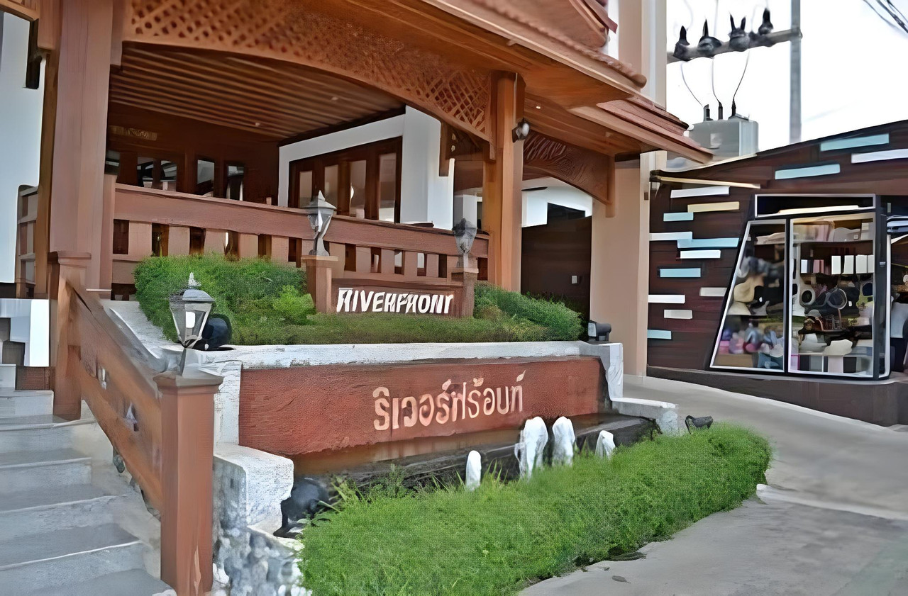 Thai timber-style hotel entrance beside the Indochina Market district, Mukdahan