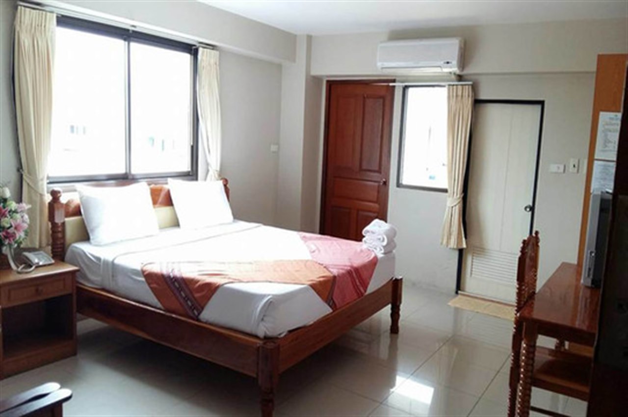 Double room at Submukda Grand Hotel with large windows, wall air-conditioning and balcony access