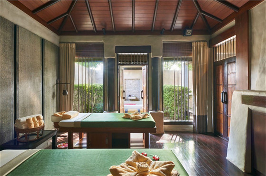 MAYA Spa Thai-style pavilion with twin massage beds opening to a garden