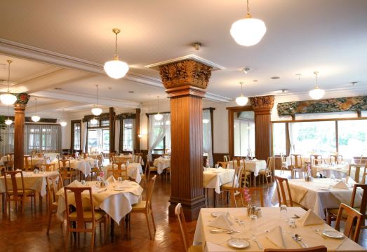 Main Dining Room of Nikko Kanaya Hotel — ornate carved pillars and white-tablecloth French service