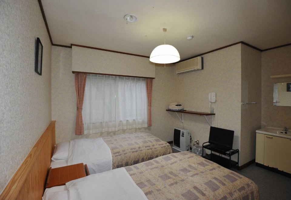 Turtle Inn Nikko Western-style twin room with pine-wood panelling, clean and light