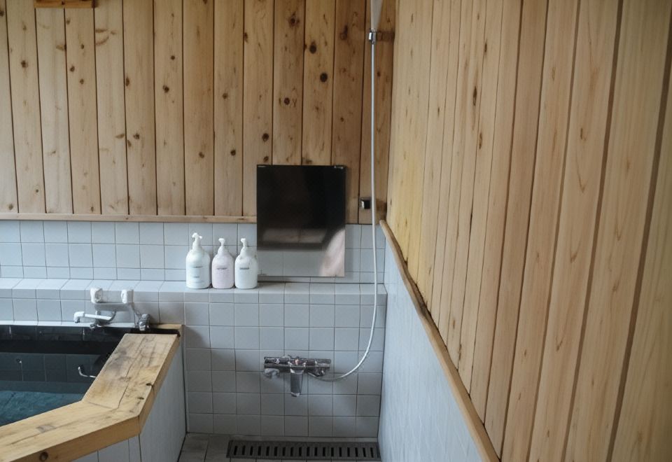 Turtle Inn Nikko private onsen bath room with tiled walls and natural wood finish