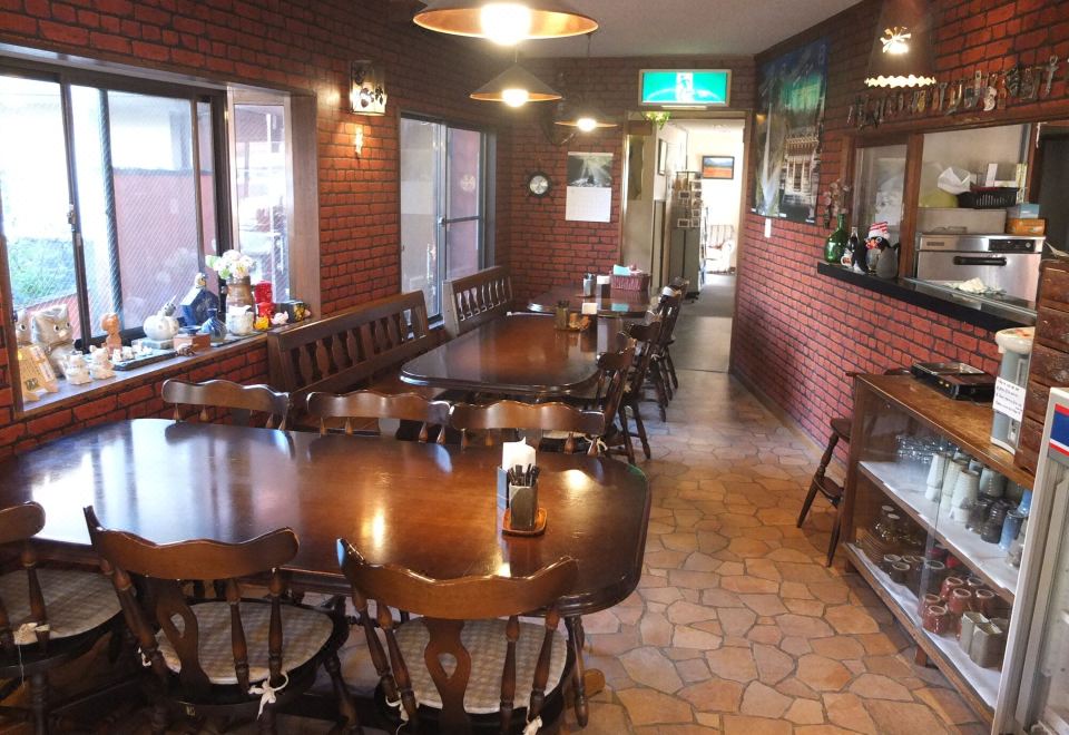 Turtle Inn Nikko dining room with charming brick walls and wooden tables