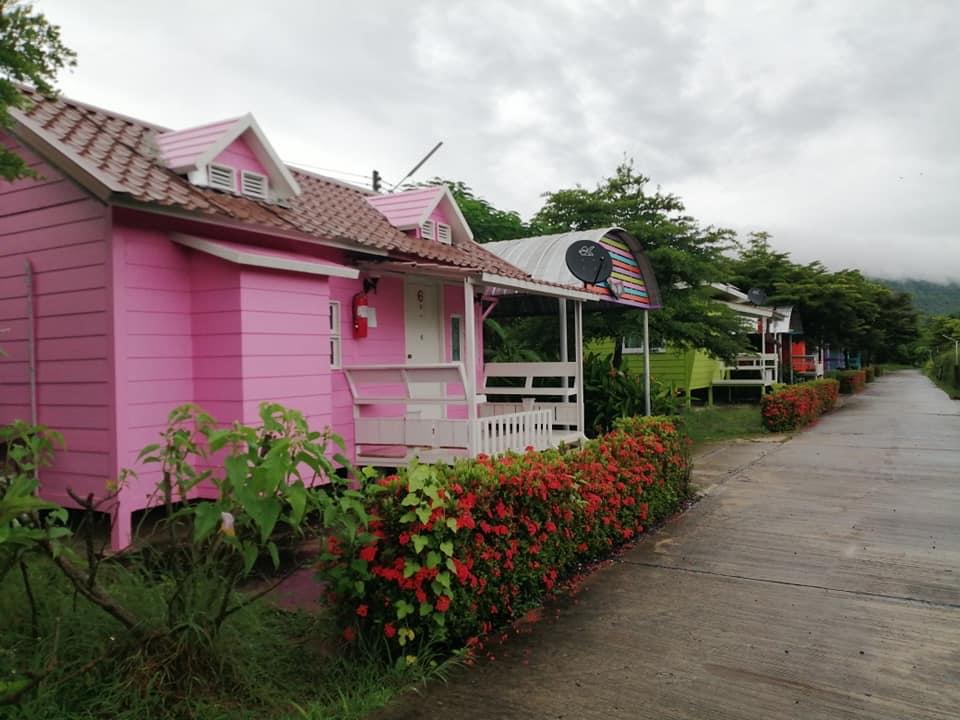 Row of pastel bungalows in the garden at Phutawan Resort Nong Bua Lamphu