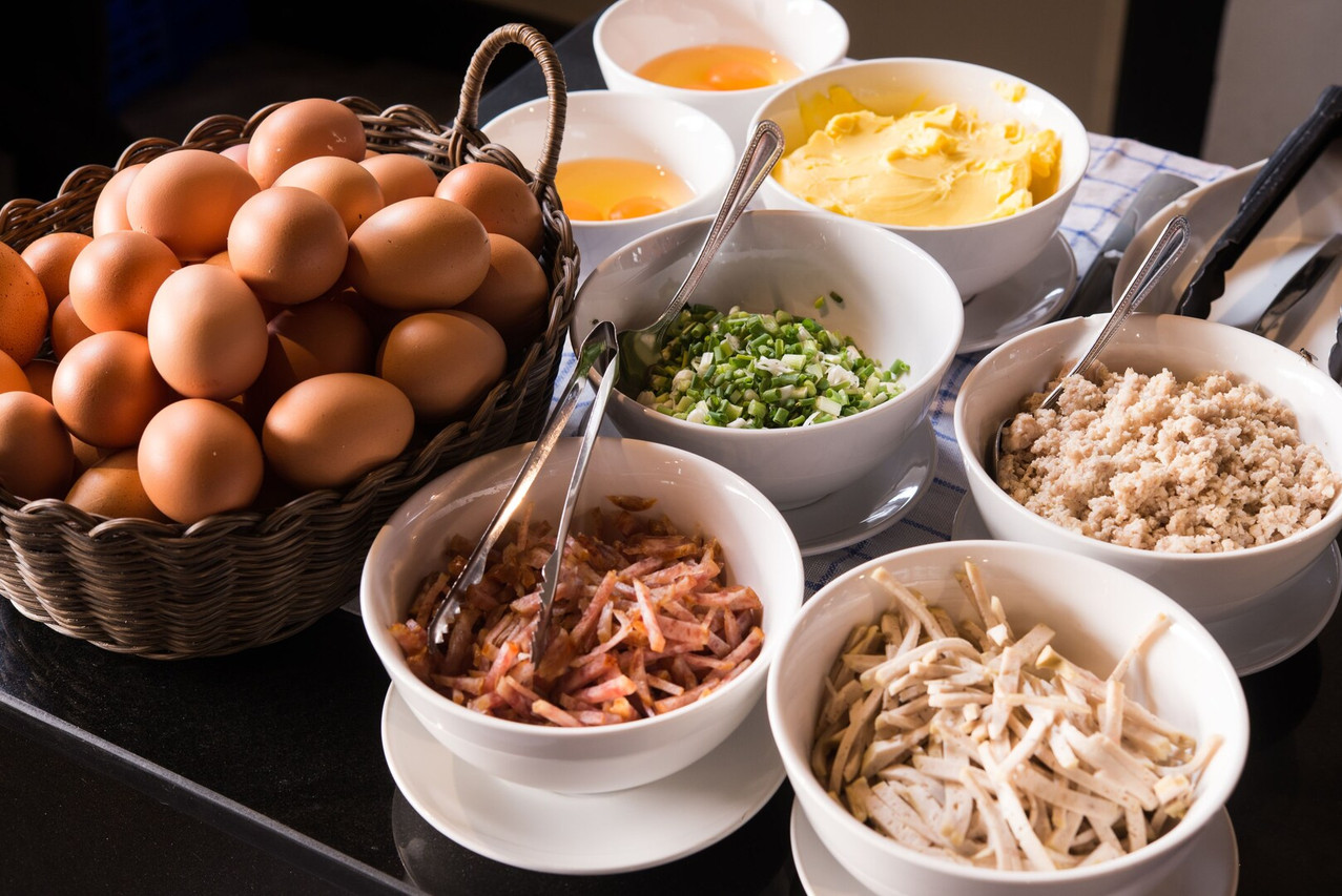 Breakfast buffet with eggs and Isan-style and international sides