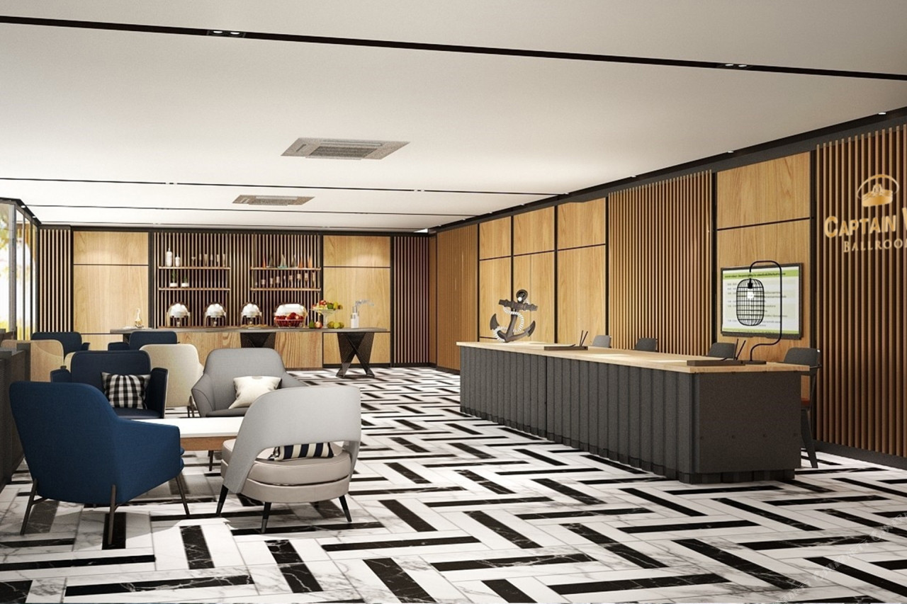 Maritime-themed lobby and lounge with a black-and-white marble floor at Bella B Hotel
