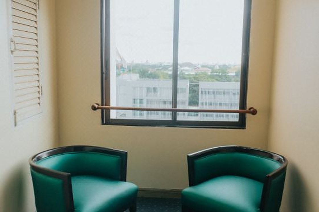 Seating corner by the window with a view over the Suan Yai side of Nonthaburi