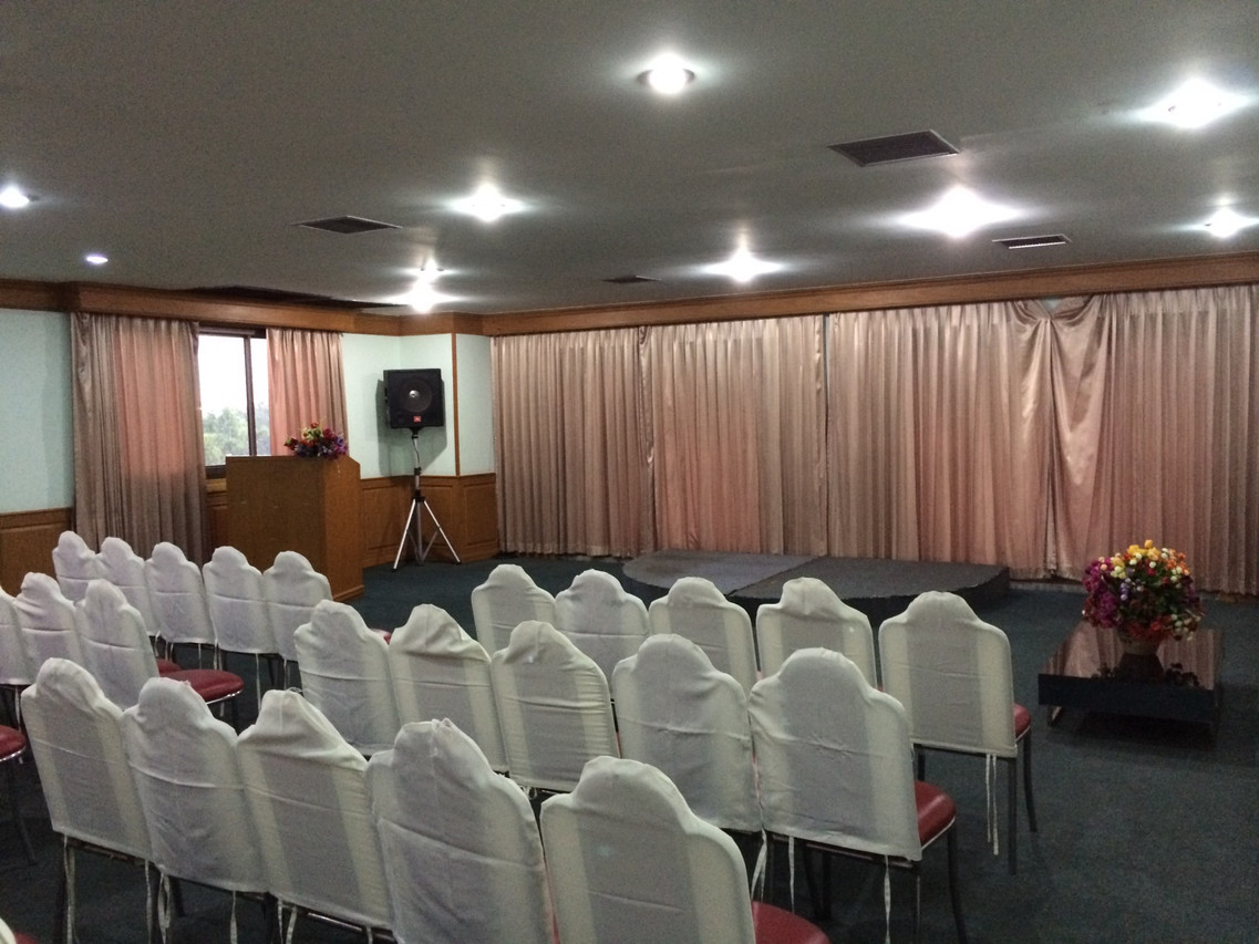 Meeting room arranged theatre-style with chair covers